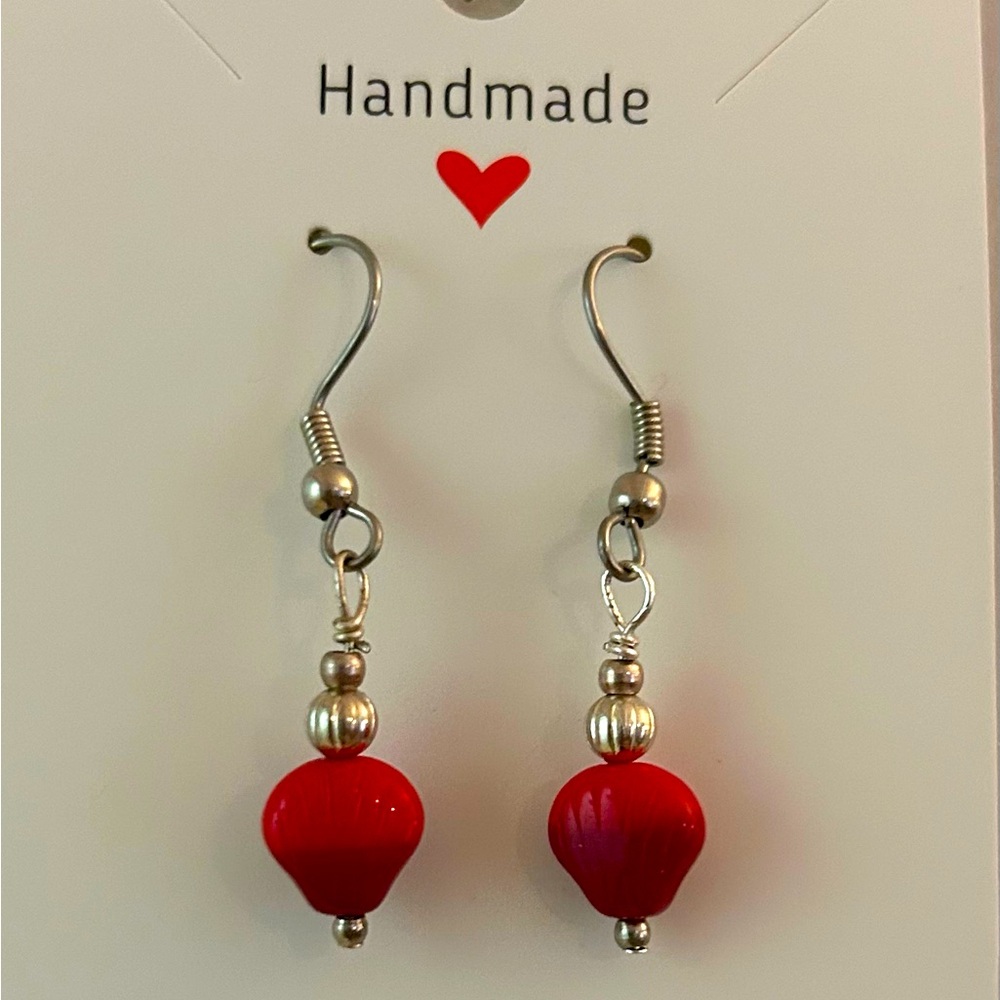 Shell dangle earrings- two toned red shell bead, offset by silver accents.